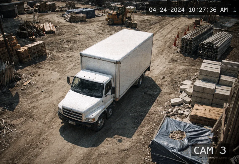 Overhead surveillance camera view of a delivery truck on a construction site, labeled CAM 3