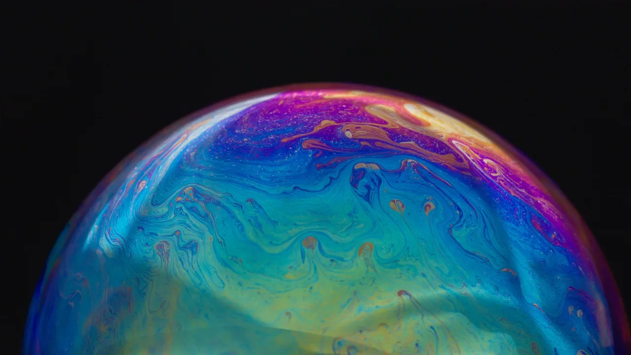 Iridescent soap bubble rising like a planet over the bottom edge